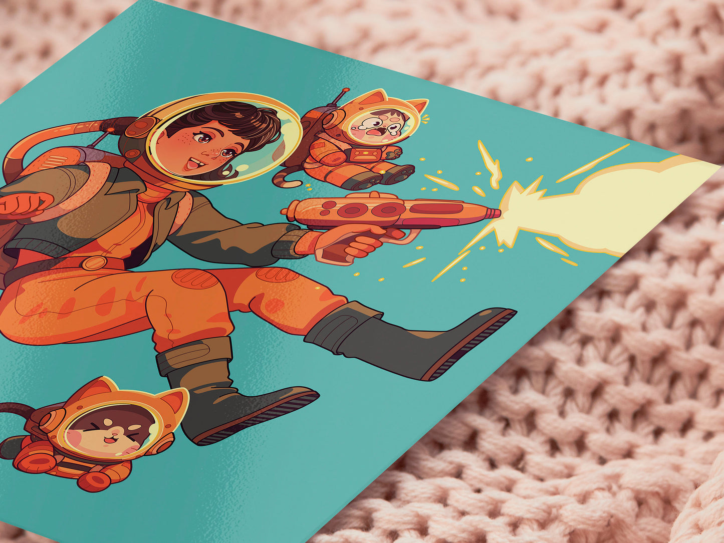 Square art print depicting a young astronaut firing a ray gun, while three adorable cats in spacesuits react.