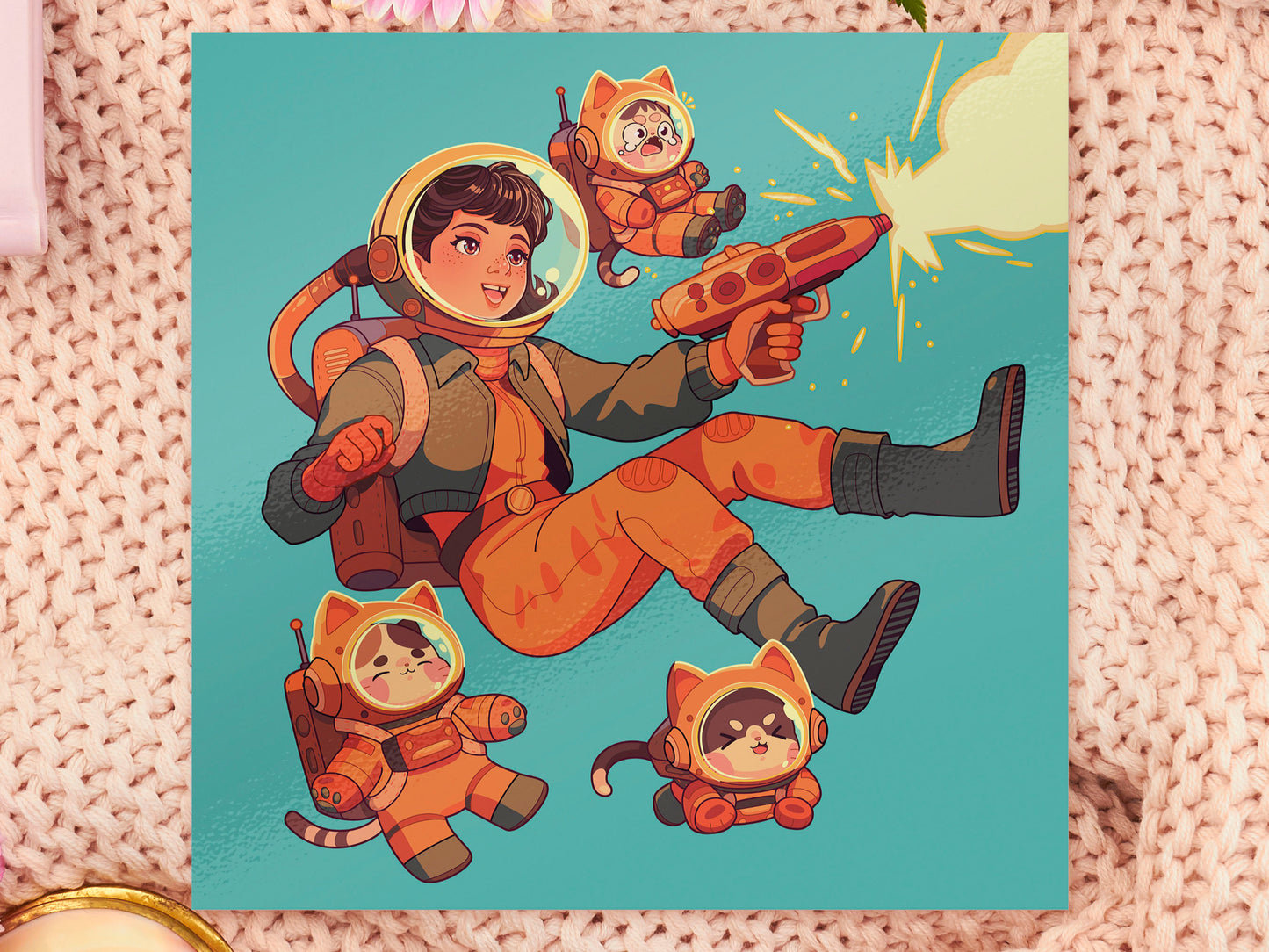 Square art print depicting a young astronaut firing a ray gun, while three adorable cats in spacesuits react.