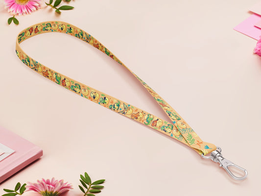Cute full legth yellow lanyard with a double sided baby dinosuras hatcing from eggs pattern and silver swivel hook clasp.