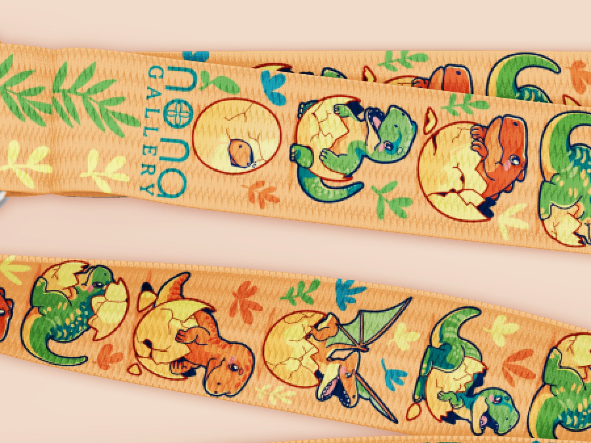Cute full legth yellow lanyard with a double sided baby dinosuras hatcing from eggs pattern and silver swivel hook clasp.