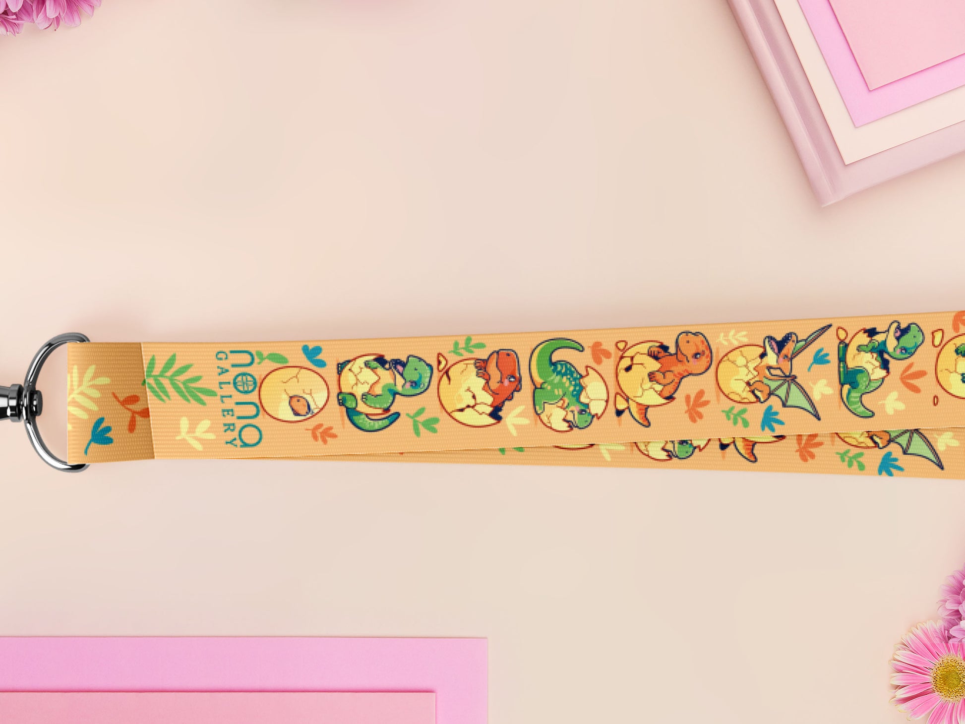 Cute full legth yellow lanyard with a double sided baby dinosuras hatcing from eggs pattern and silver swivel hook clasp.