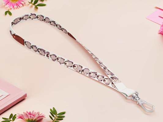 Cute full legth white lanyard with a double sided baby emperor penguin and Pesto pattern and silver swivel hook clasp.