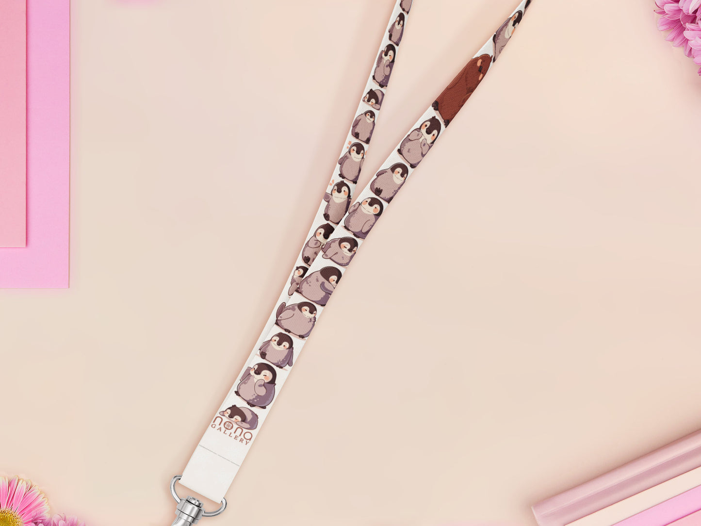 Cute full legth white lanyard with a double sided baby emperor penguin and Pesto pattern and silver swivel hook clasp.