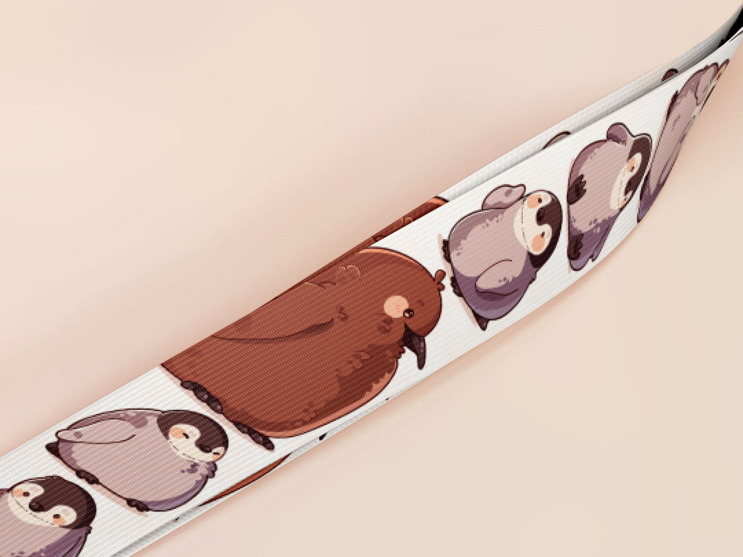Cute full legth white lanyard with a double sided baby emperor penguin and Pesto pattern and silver swivel hook clasp.