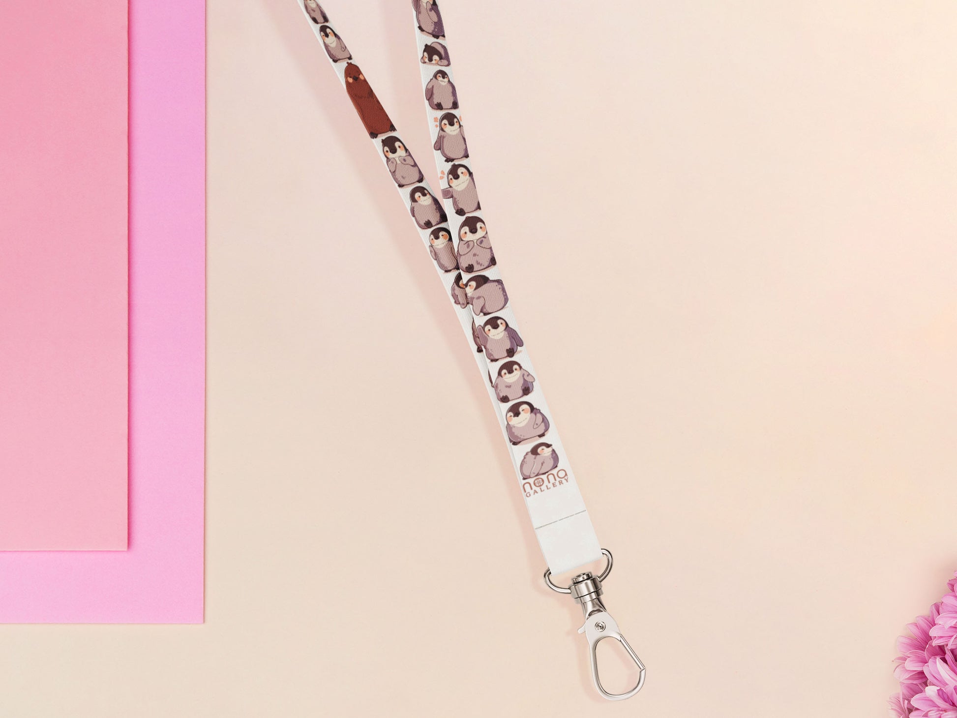 Cute full legth white lanyard with a double sided baby emperor penguin and Pesto pattern and silver swivel hook clasp.
