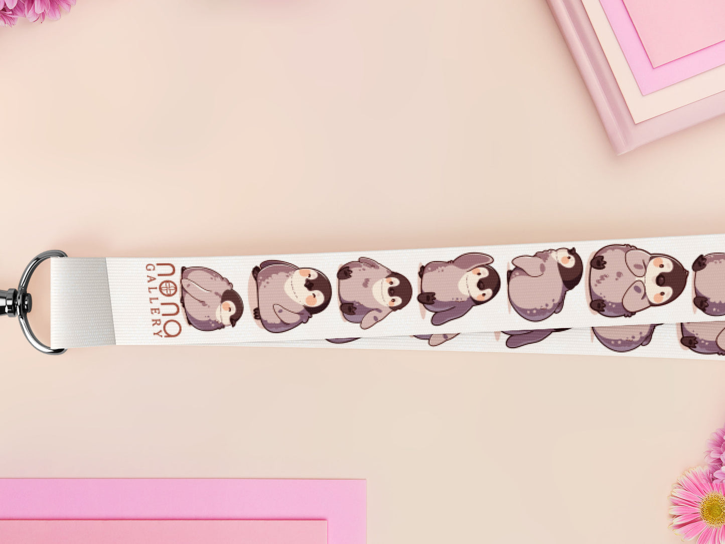 Cute full legth white lanyard with a double sided baby emperor penguin and Pesto pattern and silver swivel hook clasp.