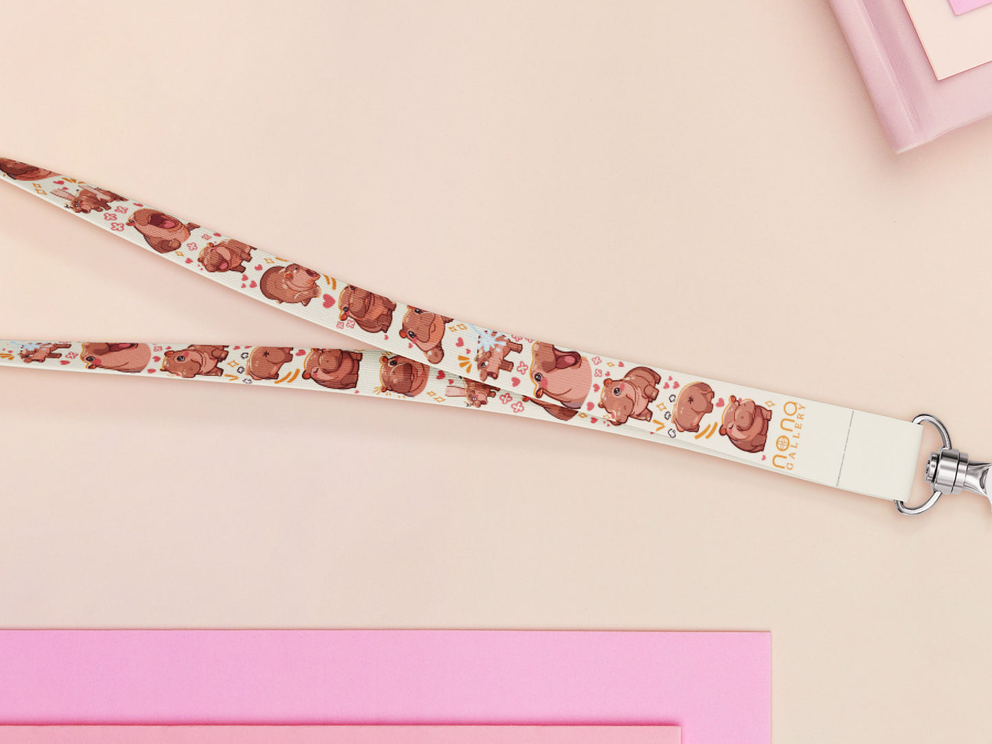 Cute full legth white lanyard with a double sided baby pygmy hippo Moo Deng pattern and silver swivel hook clasp.