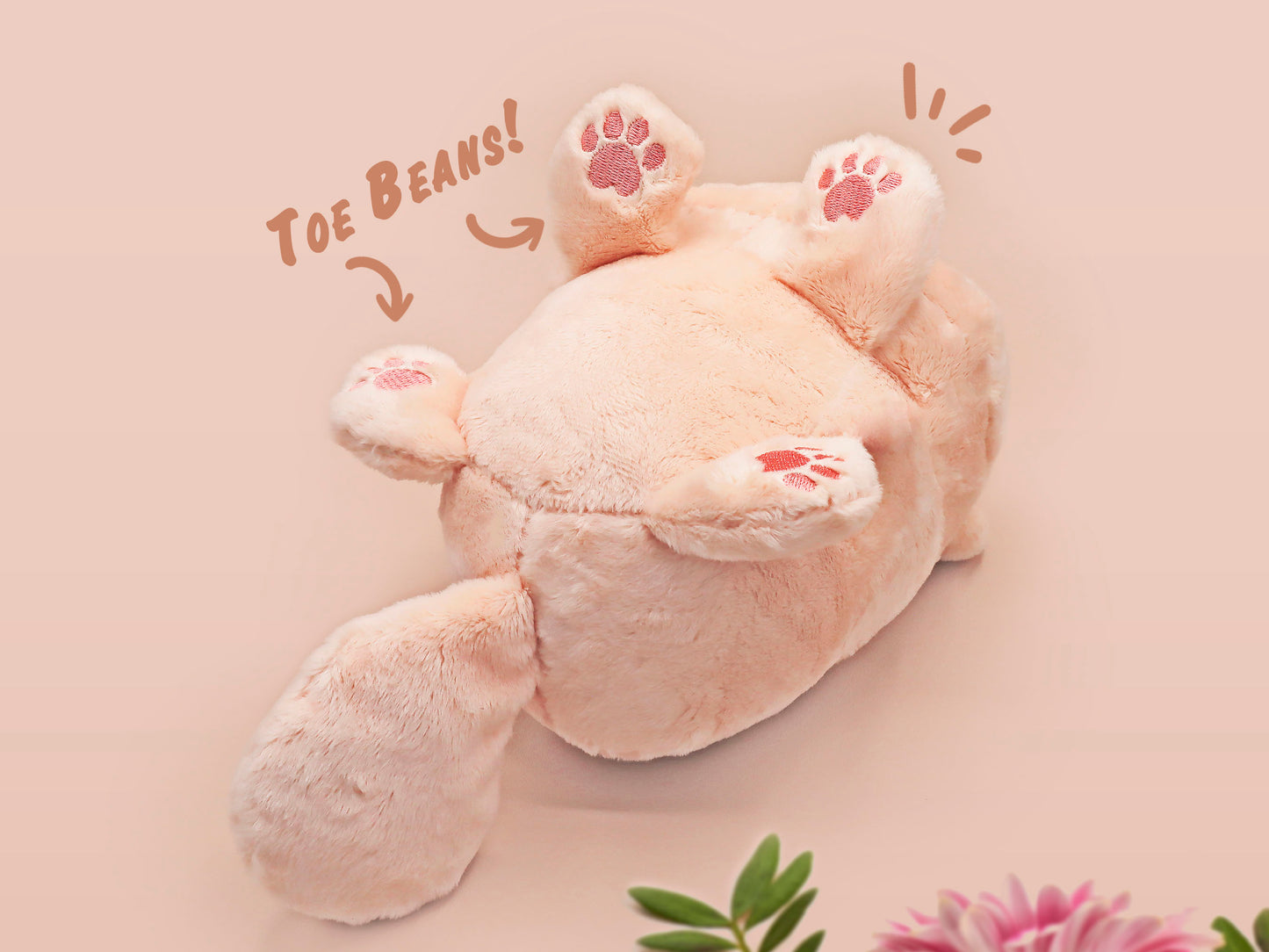 An adorable fluffy cat plushie toy with cute embroidered eyes, facial expression and applique stripes and pawprint toe beans, with a hang tag describing the cat as Brenda.