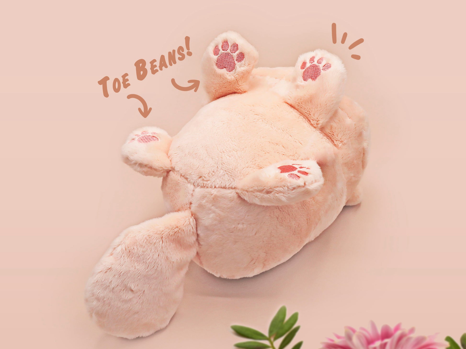An adorable fluffy cat plushie toy with cute embroidered eyes, facial expression and applique stripes and pawprint toe beans, with a hang tag describing the cat as Brenda.