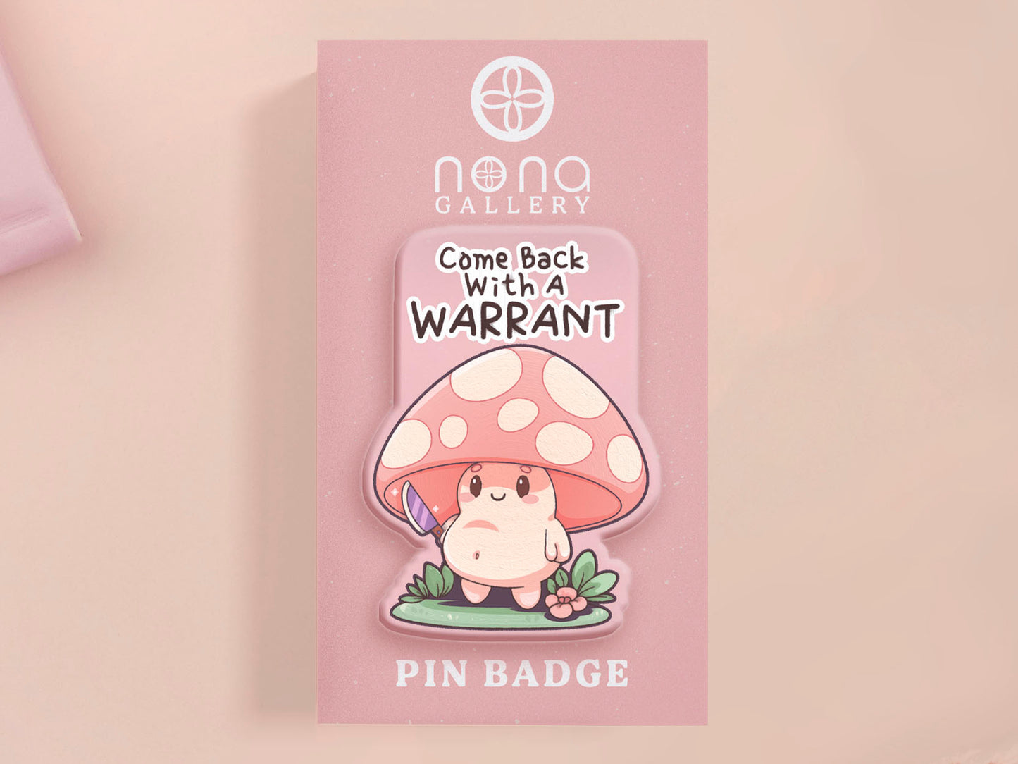 This cute transparent acrylic pin badge has a pink rubber heart shrimp pin-back clasp. The design is of a chibi cartoon mushroom with the text "Come back with a warrant."
