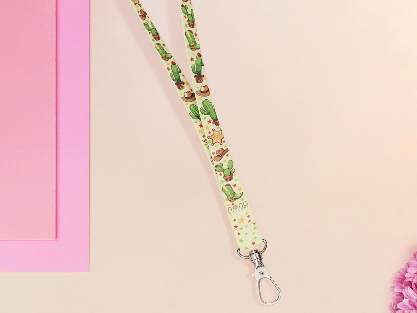 Cute full legth yellow and green lanyard with a double sided cowboy western and cactus themed pattern and silver swivel hook clasp.