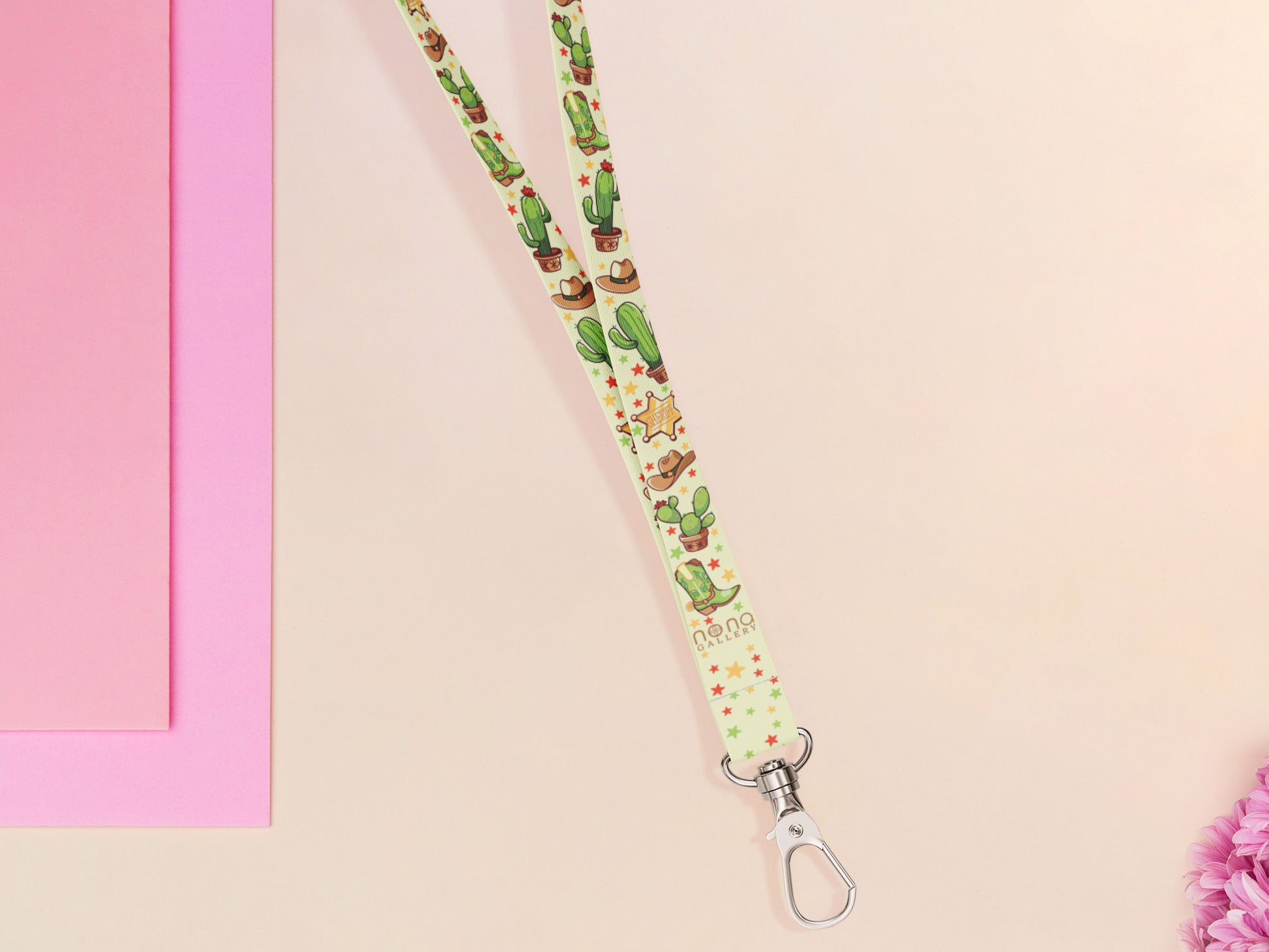 Cute full legth yellow and green lanyard with a double sided cowboy western and cactus themed pattern and silver swivel hook clasp.