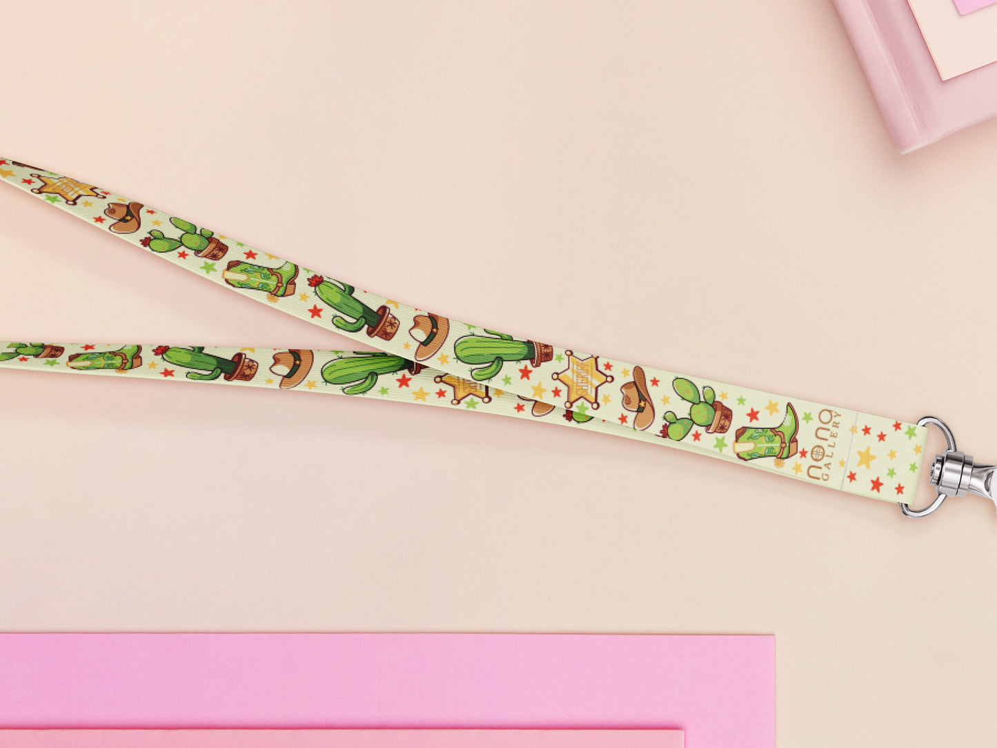 Cute full legth yellow and green lanyard with a double sided cowboy western and cactus themed pattern and silver swivel hook clasp.