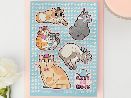 Large sticker sheet of digital illustration cartoons of various cute cats wearing different hats, such as rag dolls, Siamese, grey, ginger, calico and striped cats and kittens