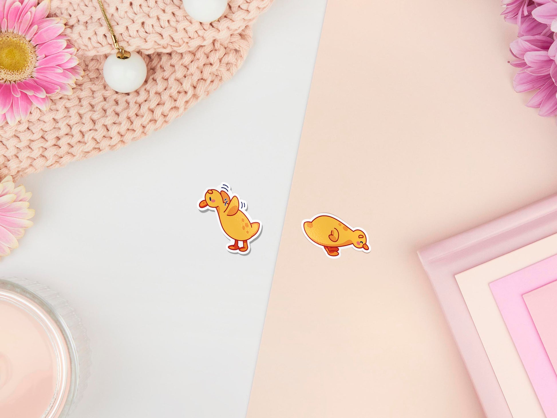 Two stickers of digitally illustrated cartoon of small yellow ducklings