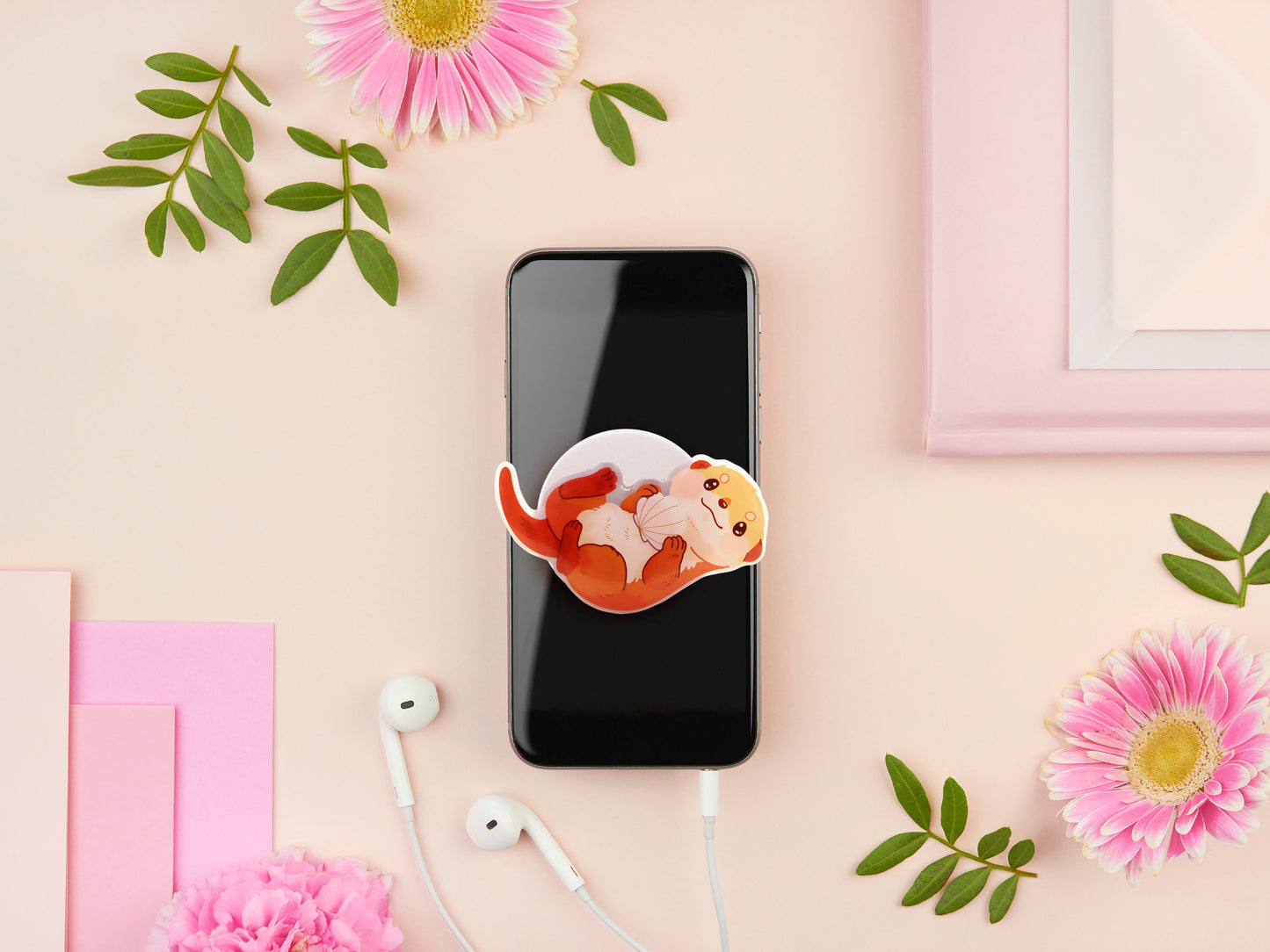 Cute acrylic popsocket phone grip of a sea otter holding a clam shell