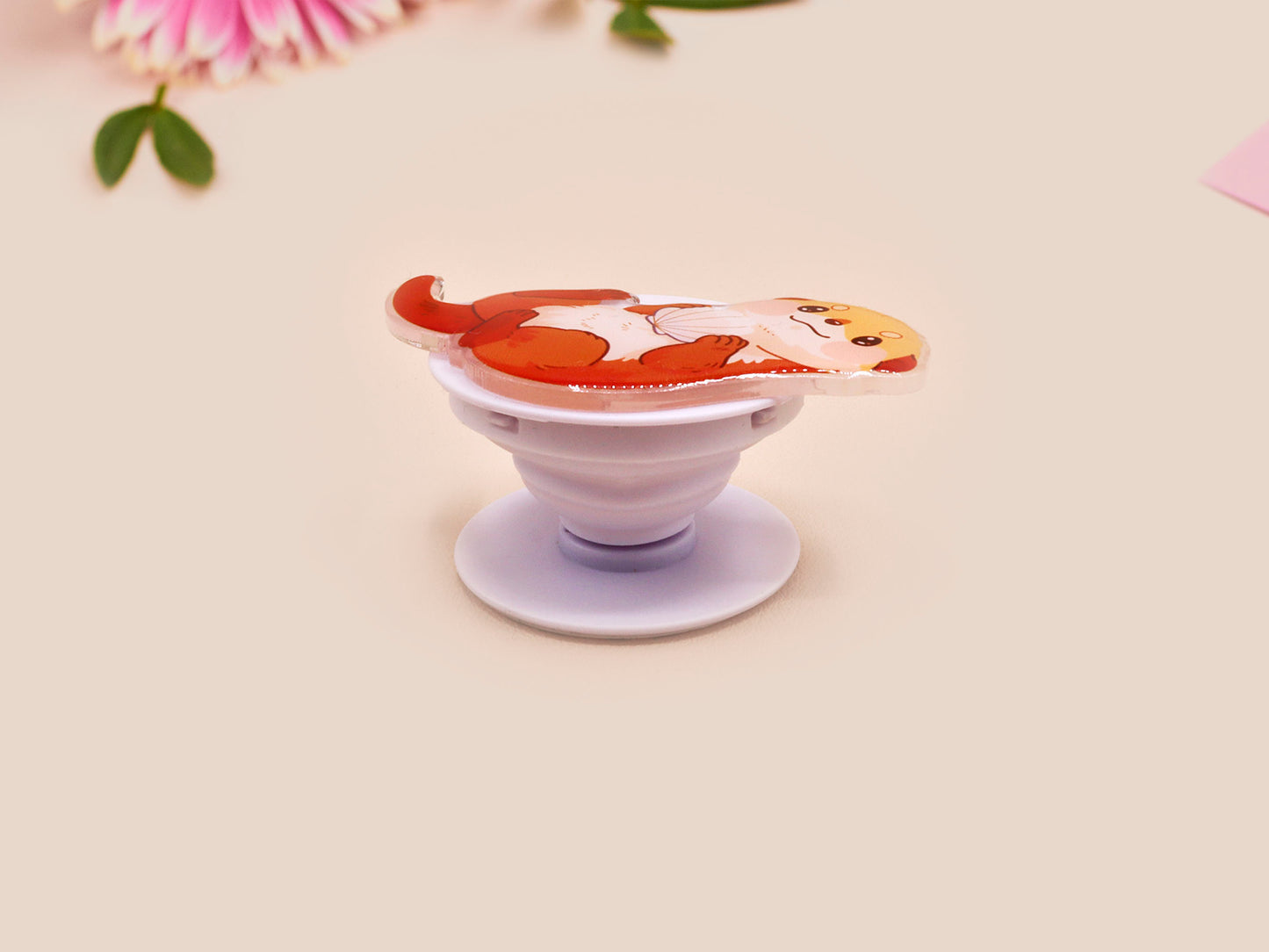 Cute acrylic popsocket phone grip of a sea otter holding a clam shell