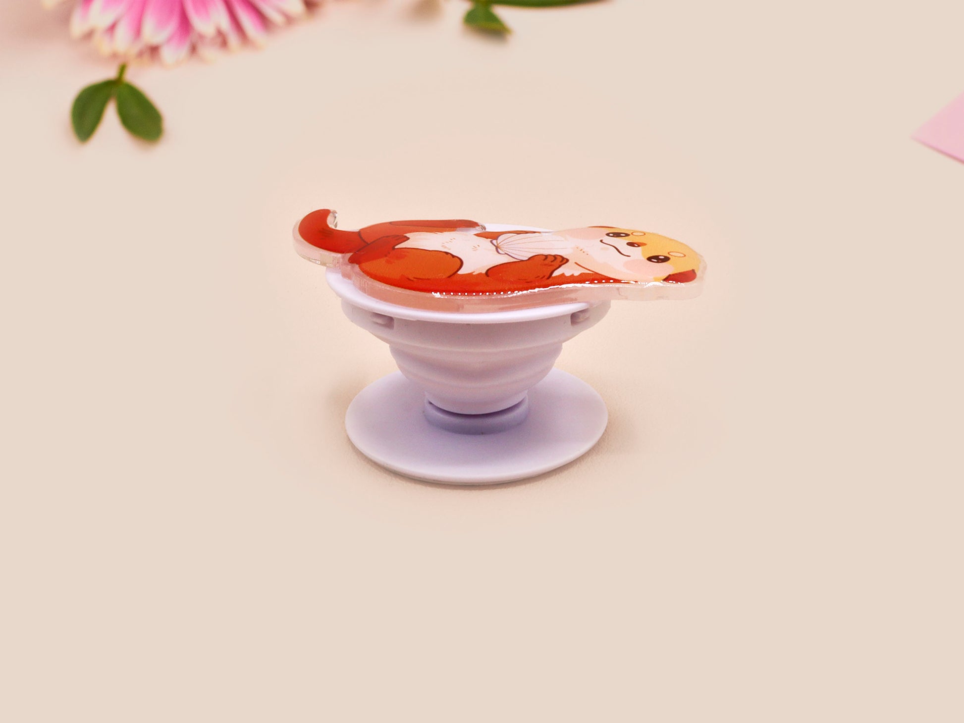 Cute acrylic popsocket phone grip of a sea otter holding a clam shell