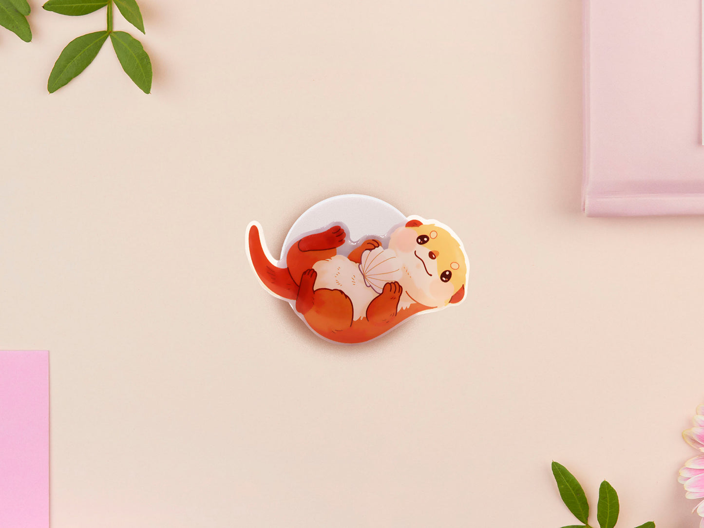 Cute acrylic popsocket phone grip of a sea otter holding a clam shell