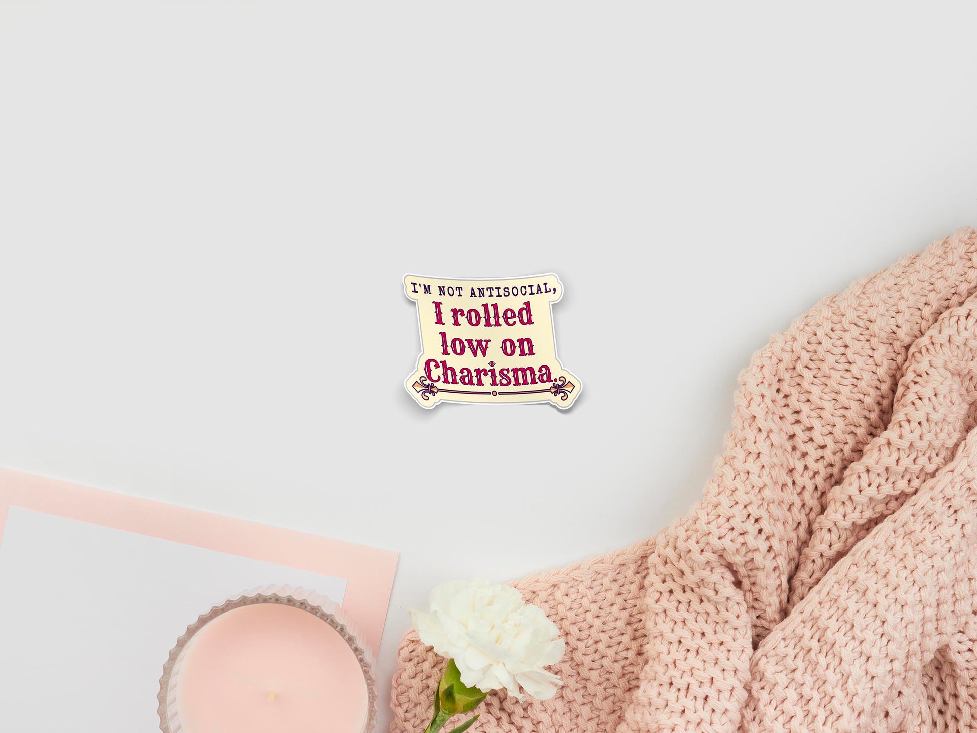 Large sticker of digital illustration cartoons of a the text quote I'm not antisocial, I rolled low on charisma