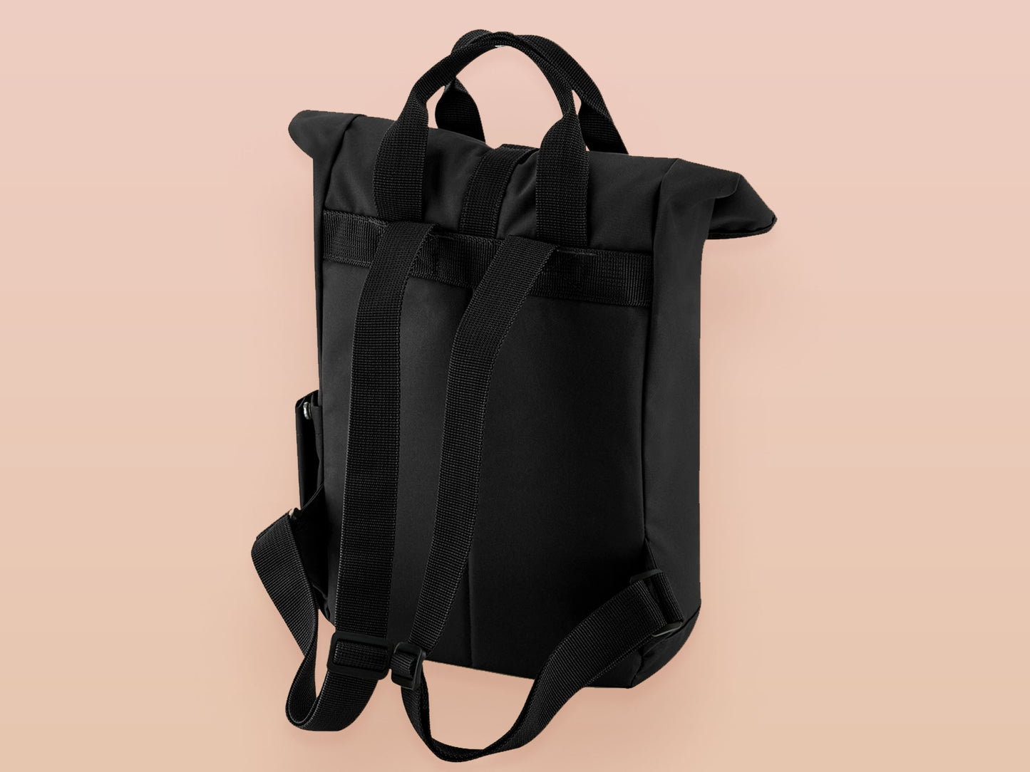 Black roll top backpack with a front pocket and an embroided mimic chest face cryptid design with the text *definetley not a mimic