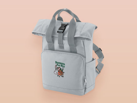 Light Grey roll top twin handle backpack with an embroidered design of a stressed out pack mule donkey and the quote designated pack mule