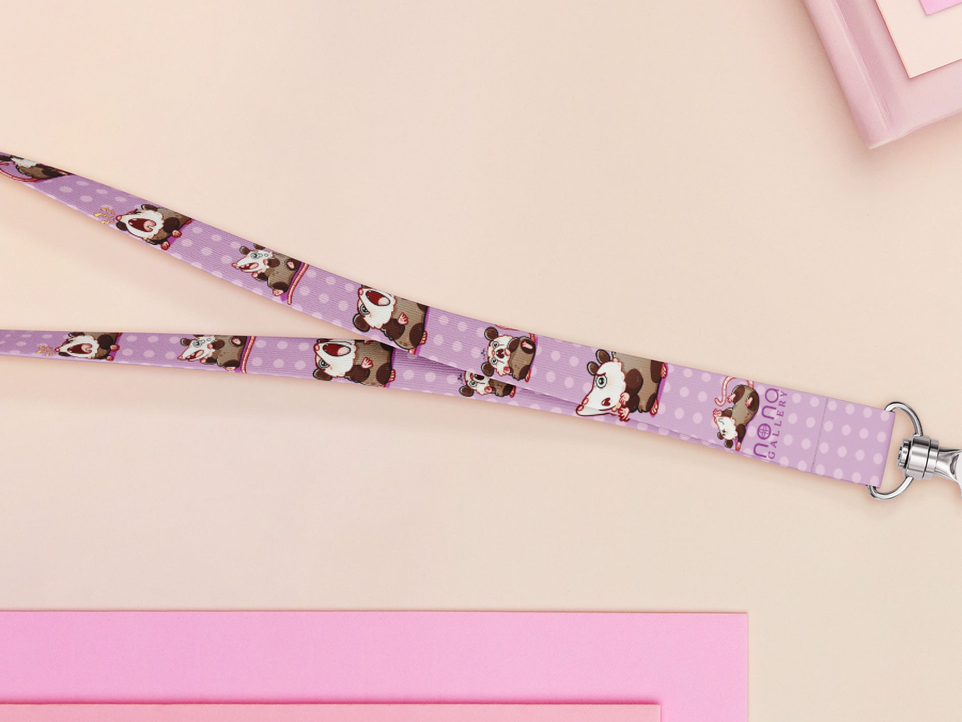 Cute full legth purple lanyard with a double sided funny screaming possums  pattern and silver swivel hook clasp.
