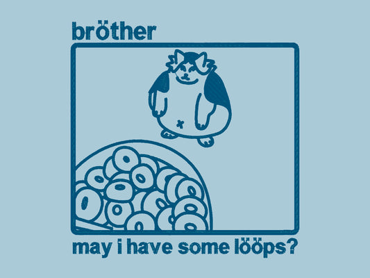 A blue crew neck short sleeve t-shirt, with an embroidered blue thread design of cute fat cat sat looking at a bowl of fruit loop cereal framed in a box with text above and below the frame reading bröther may i have some lööps?