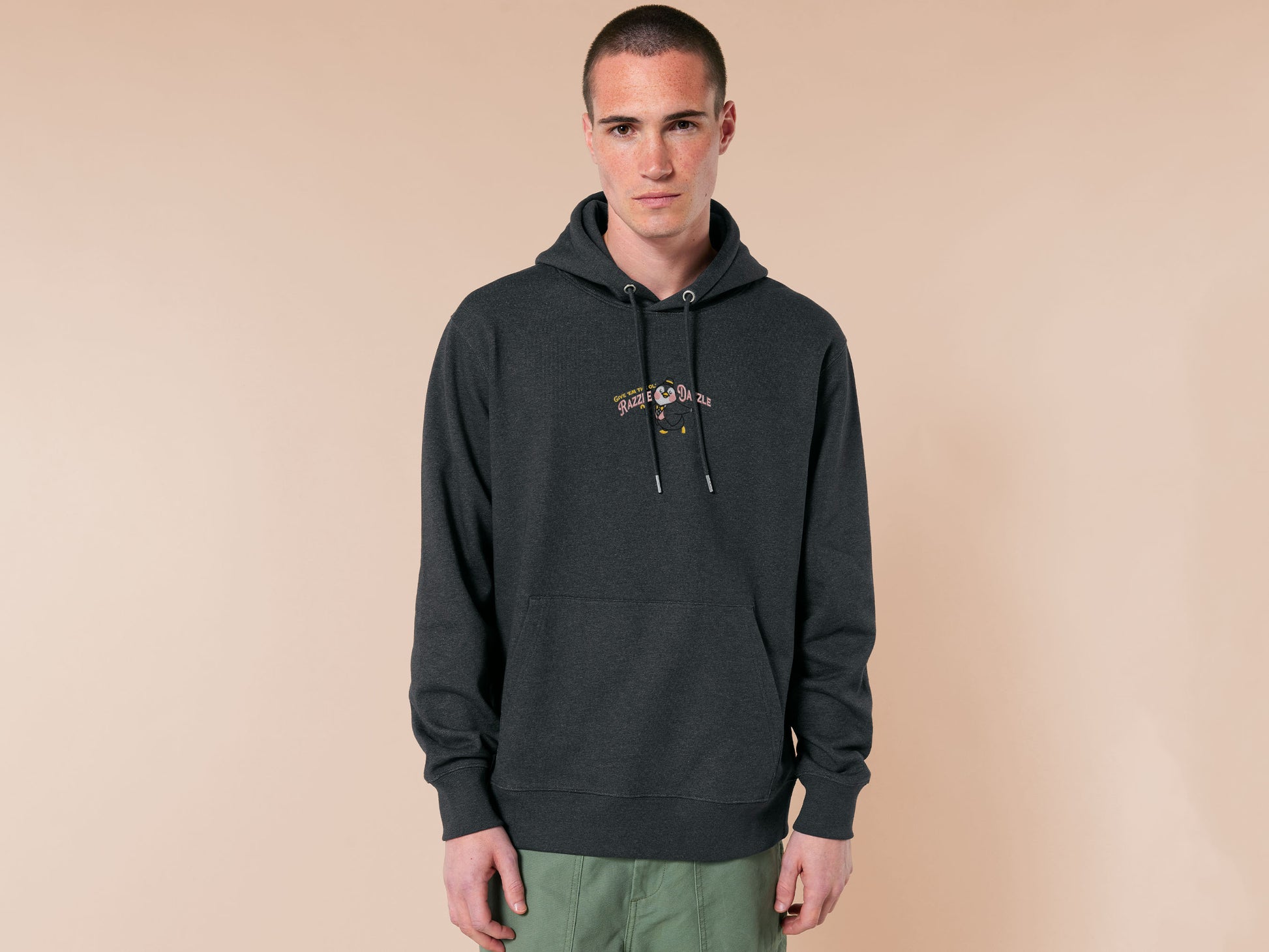A grey crew neck long sleeve hoodie, with an embroidered penguin in a fancy suit and top hat and the quote Give 'em the ol' Razzle Dazzle.
