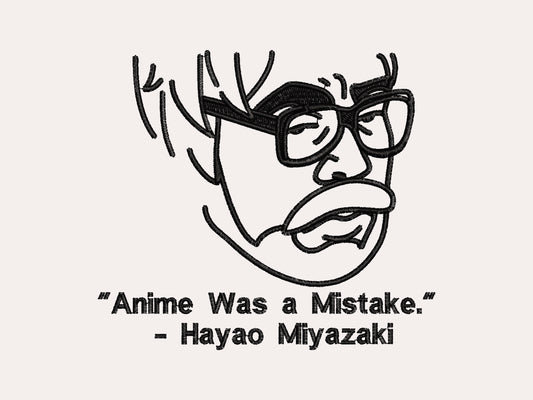 A off white crew neck short sleeve t-shirt, with an embroidered black thread design of a portrait of a depressed Hayao Miyazaki with text underneath that reads "Anime Was A Mistake." - Hayao Miyazaki