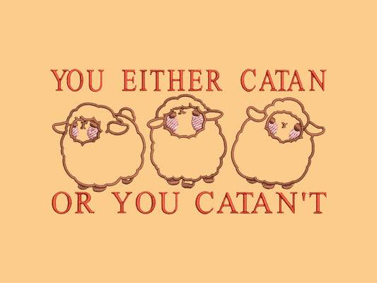 A yellow top with a brown and red embroidered design of cute chibi sheep with the text you either catan or you catan't