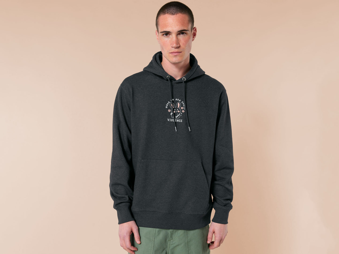 An embroidered dark grey hoodie with a cute chibi bunny and the text Woke Up And Chose Violence.