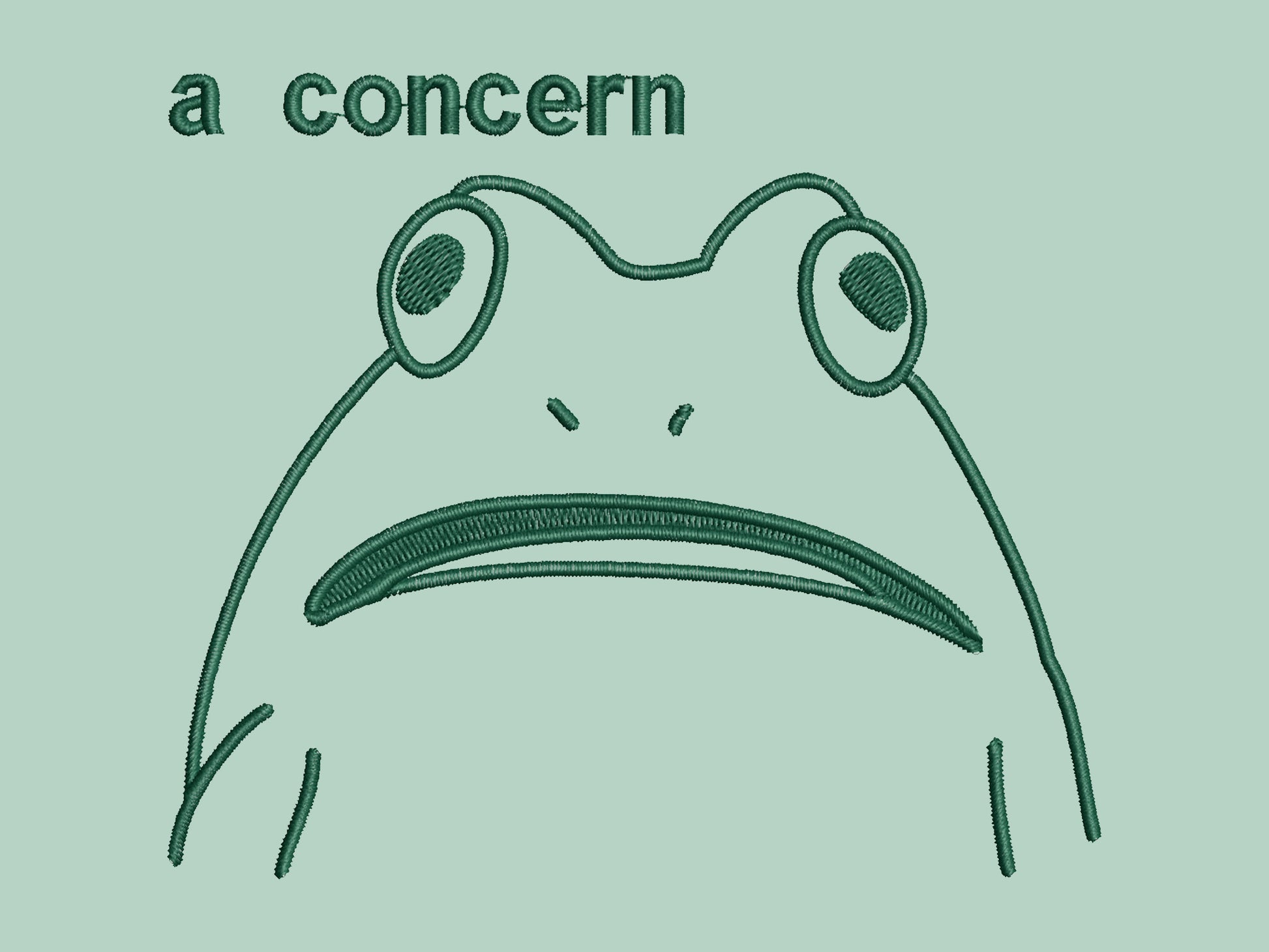 An embroidered green t-shirt design of a funny cartoon frog with the text a concern.