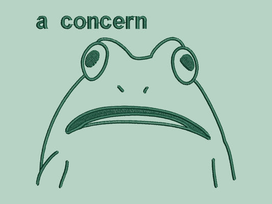 An embroidered green t-shirt design of a funny cartoon frog with the text a concern.