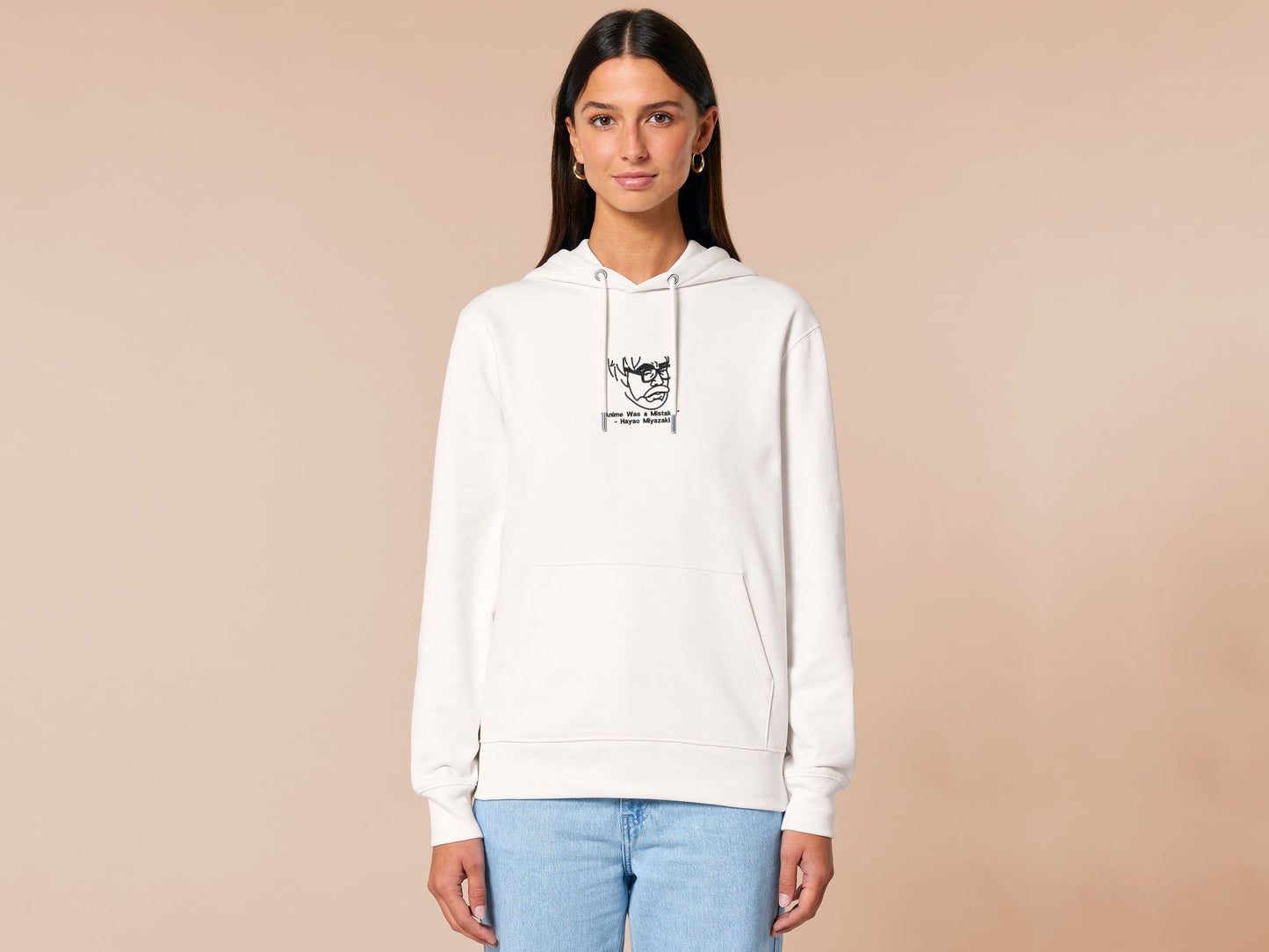 A off white crew neck long sleeve hoodie, with an embroidered black thread design of a portrait of a depressed Hayao Miyazaki the creator of Studio Ghibli with text underneath that reads "Anime Was A Mistake." - Hayao Miyazaki