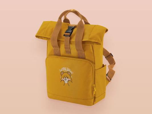 Yellow roll top twin handle backpack with an embroided design of cute crying bear and the quote emotional baggage