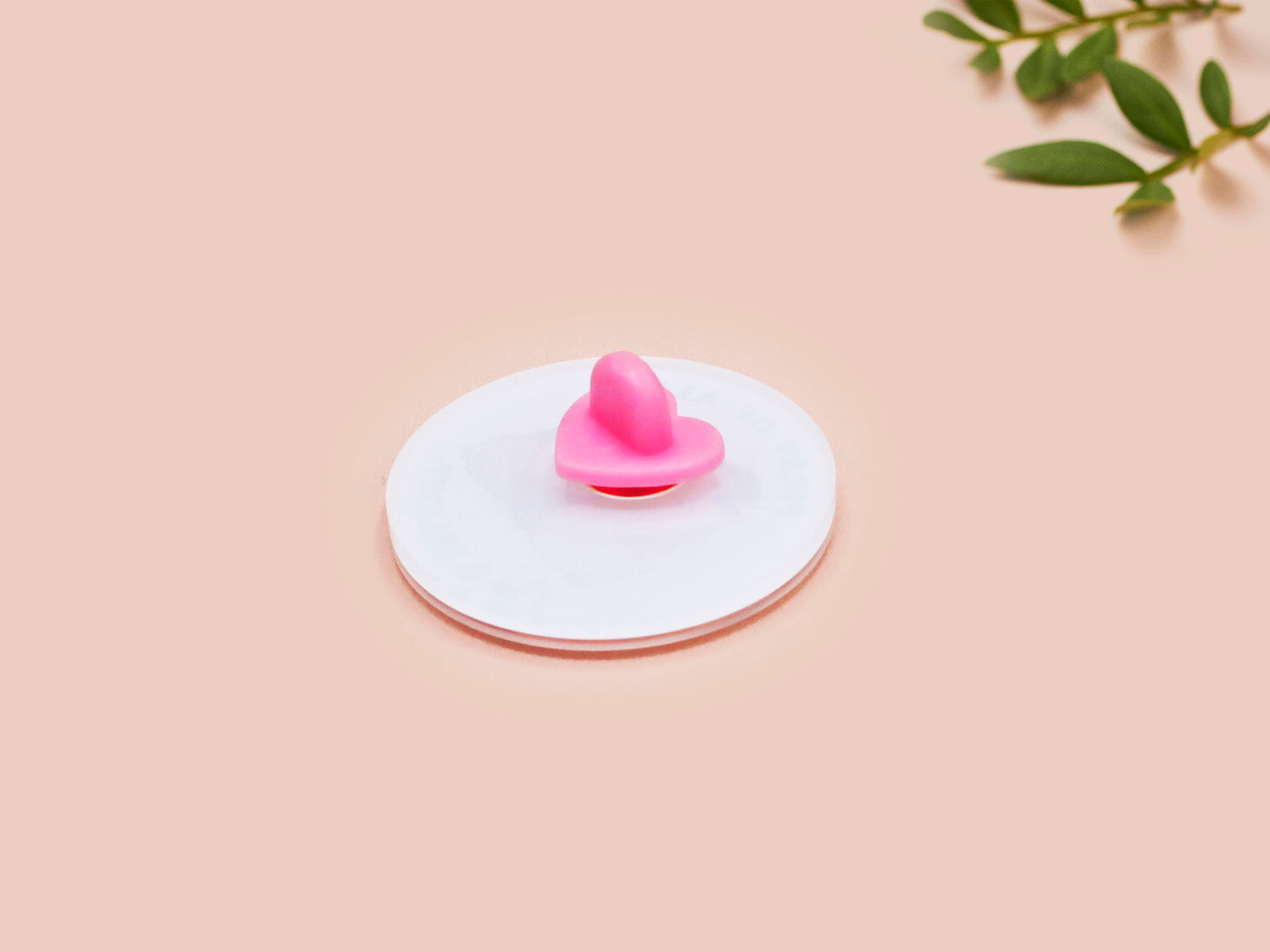 A clear acrylic pin badge with a pink heart-shaped pin back clasp. The design of the pin badge is of a cute baby penguin chicks squabbling with the quote first of all I'm a delight.