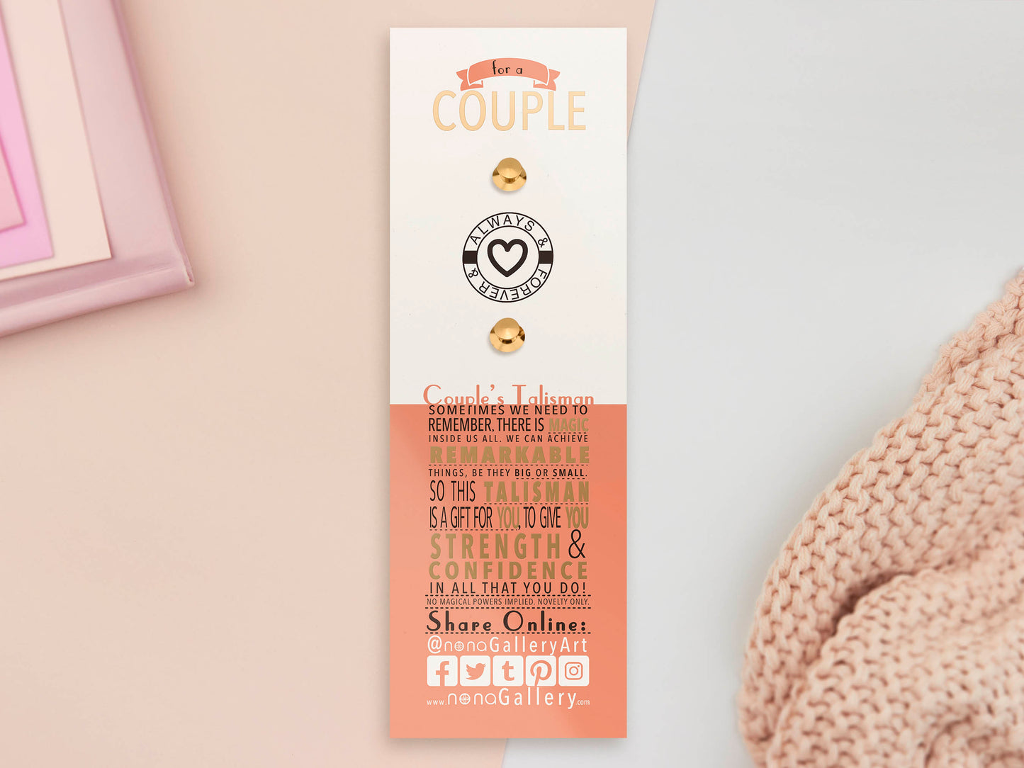 The back of the long white and red backing card with gold accents. The backing card details the symbolism of the different design elements of the couple's Talisman pin. Also shown is the two gold locking pin backs attached to the card.