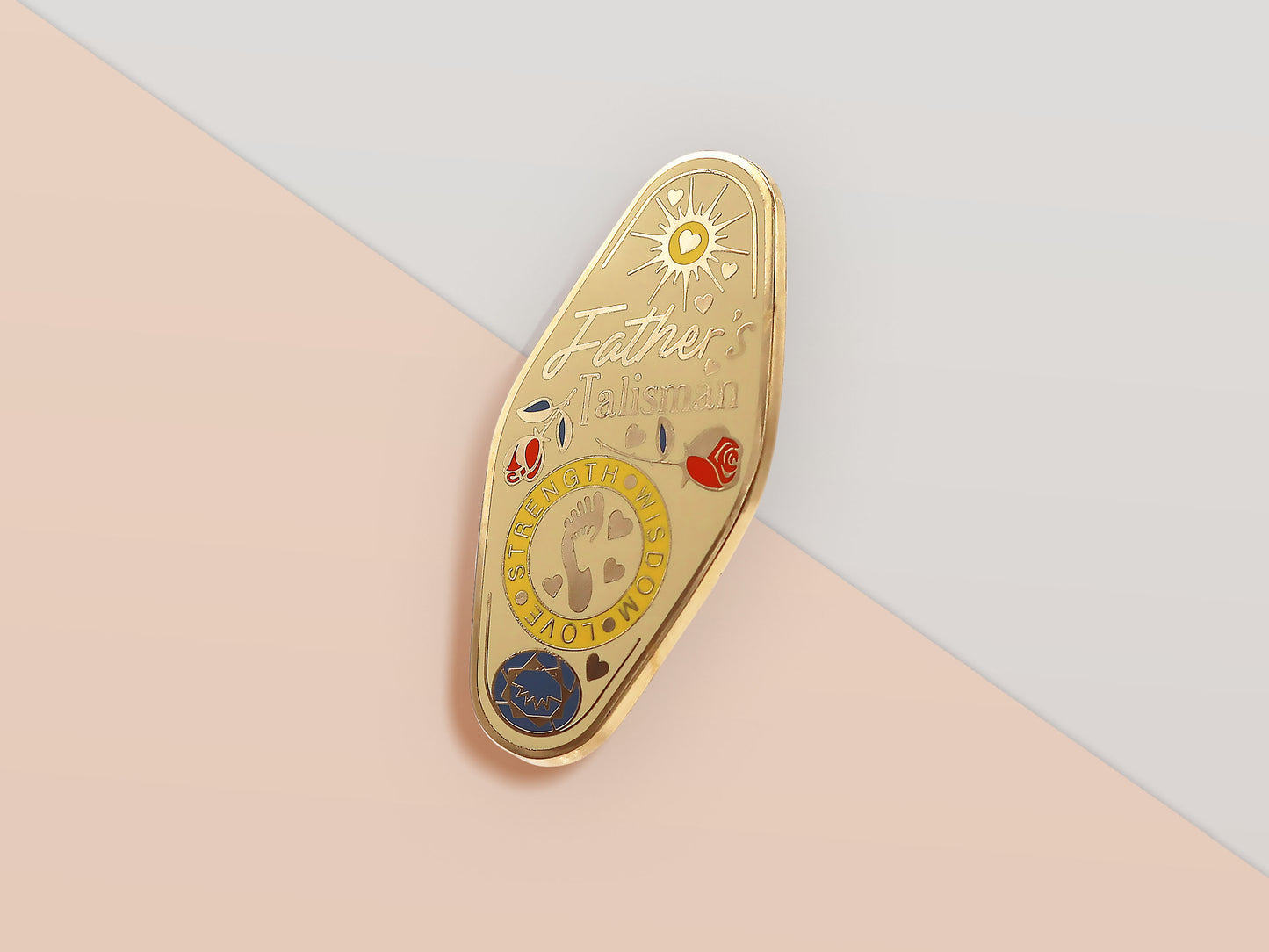 Gold Enamel Talisman Pin with yellow design and the words Father's Talisman, Strength Wisdom Love. The pins design includes a fathers and child's footprint, sunshine, hearts, as well as flowers and crystals.