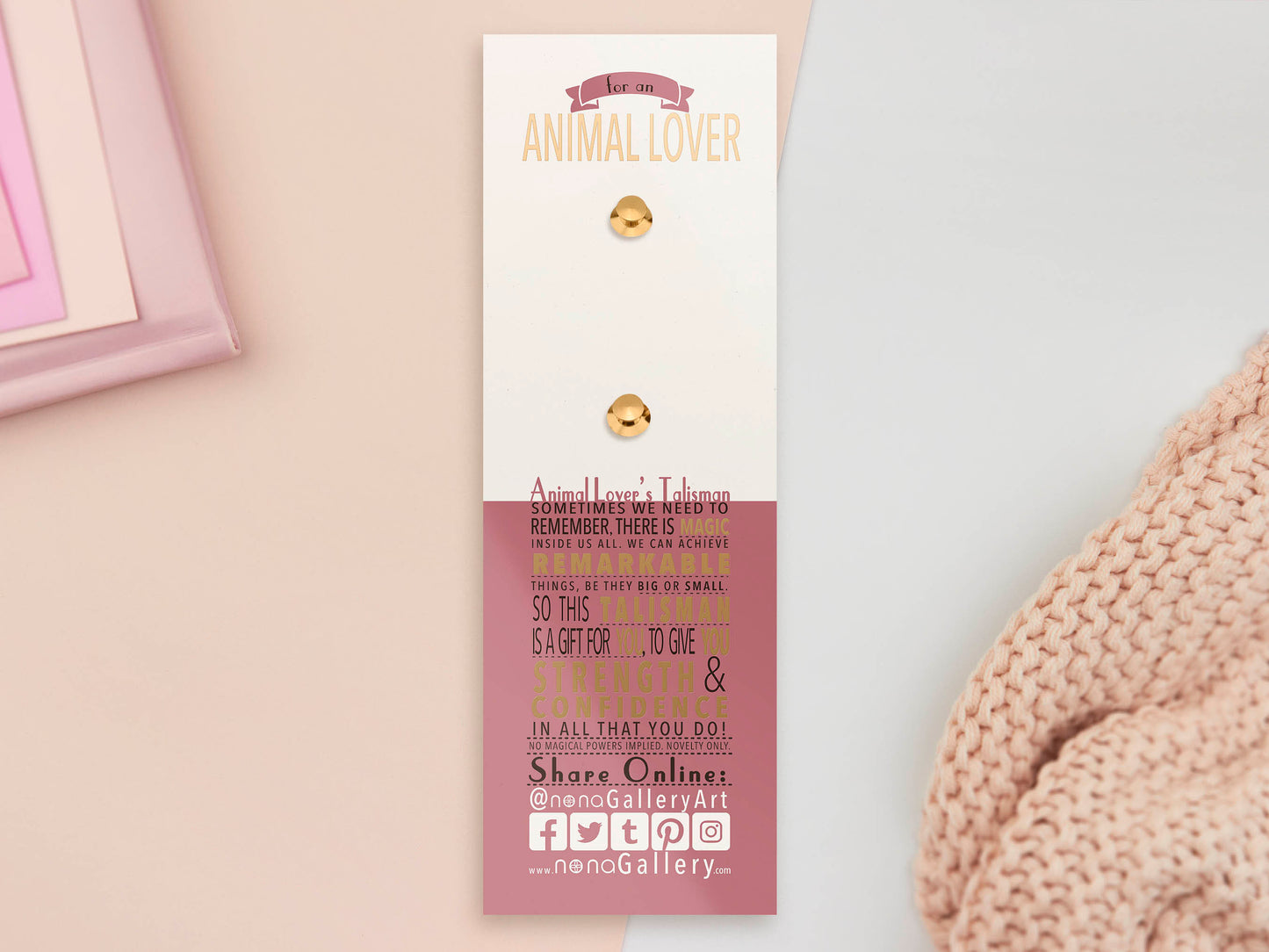 An Animal Lover's Talisman gold enamel pin on a gold foiled backing card that outlines the symbolism of the talisman including information and imagery on Magnolia flowers, yellow roses, and aragonite star clusters