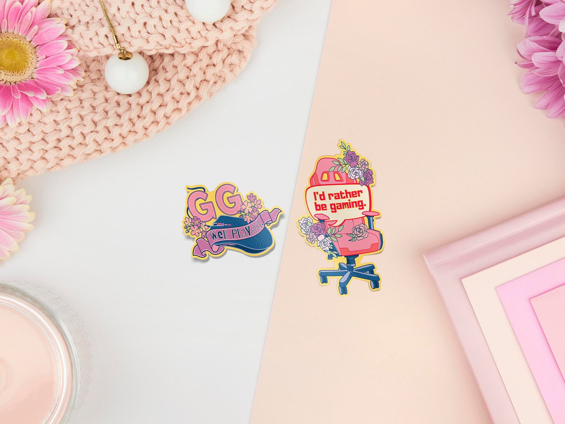 Two peelable stickers, the first stickers is a gaming mouse with a ribbon and text that reads GG Well Played. The Second sticker is a gaming chair with flowers and a speech bubble that reads I'd rather be gaming.