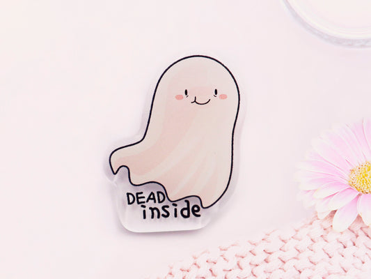 Acrylic pin badge of smiling but depressed cartoon ghost with the quote dead inside written below.