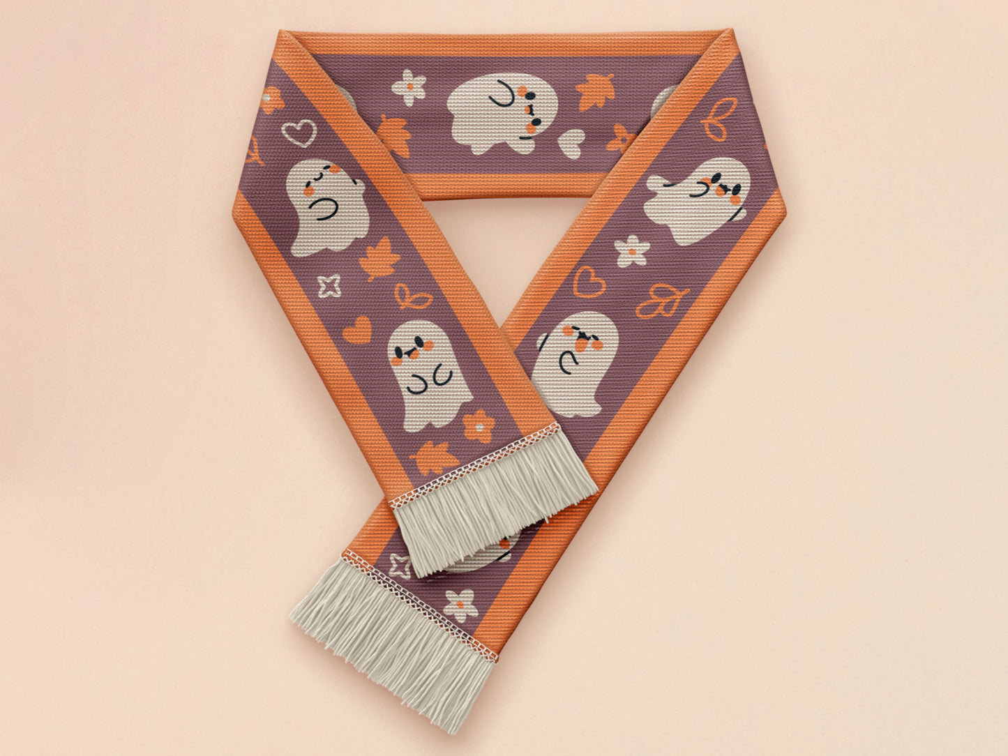 Cute knitted cotton scarf with fringe details and an autumn ghost themed pattern