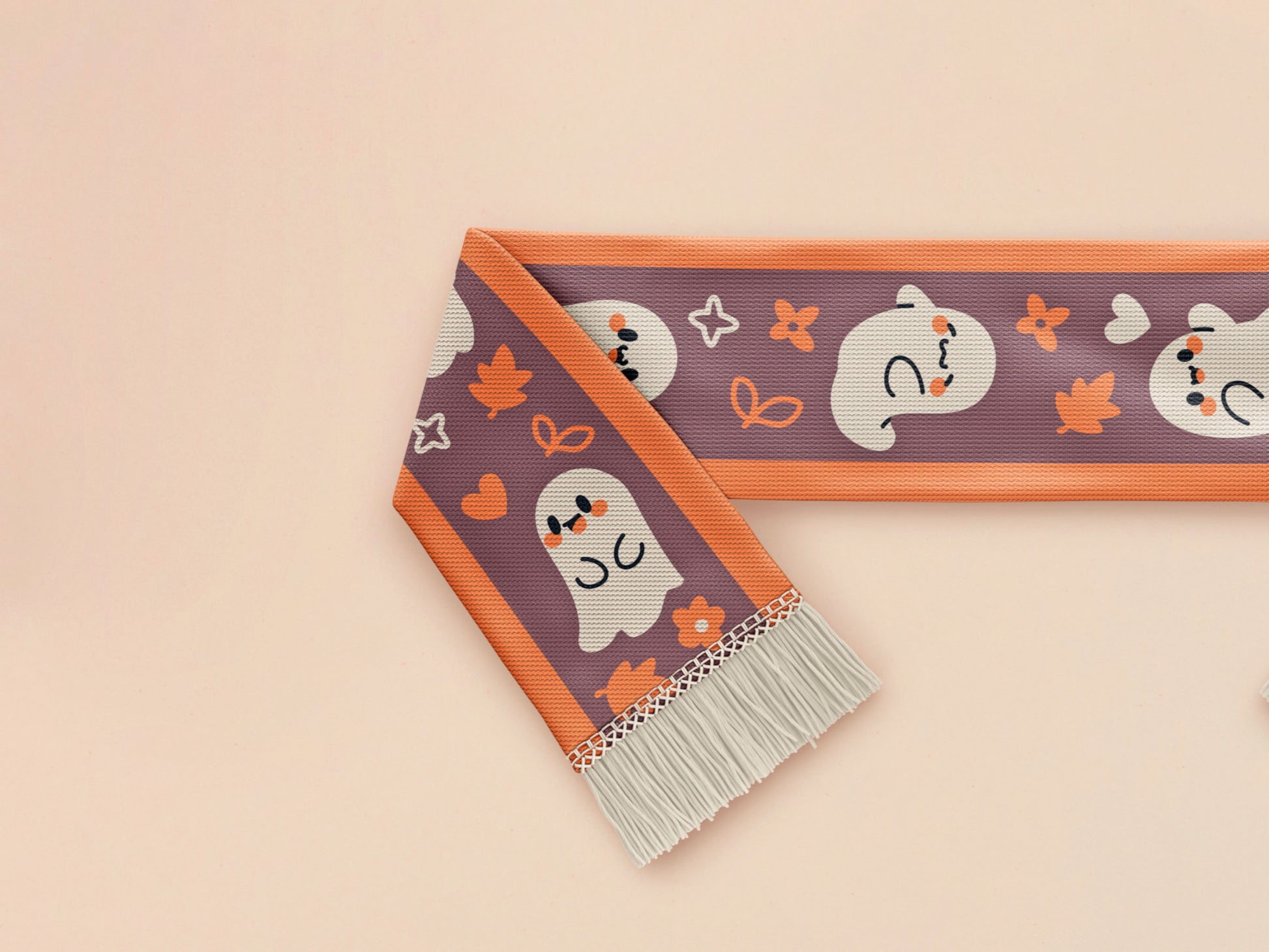 Cute knitted cotton scarf with fringe details and an autumn ghost themed pattern