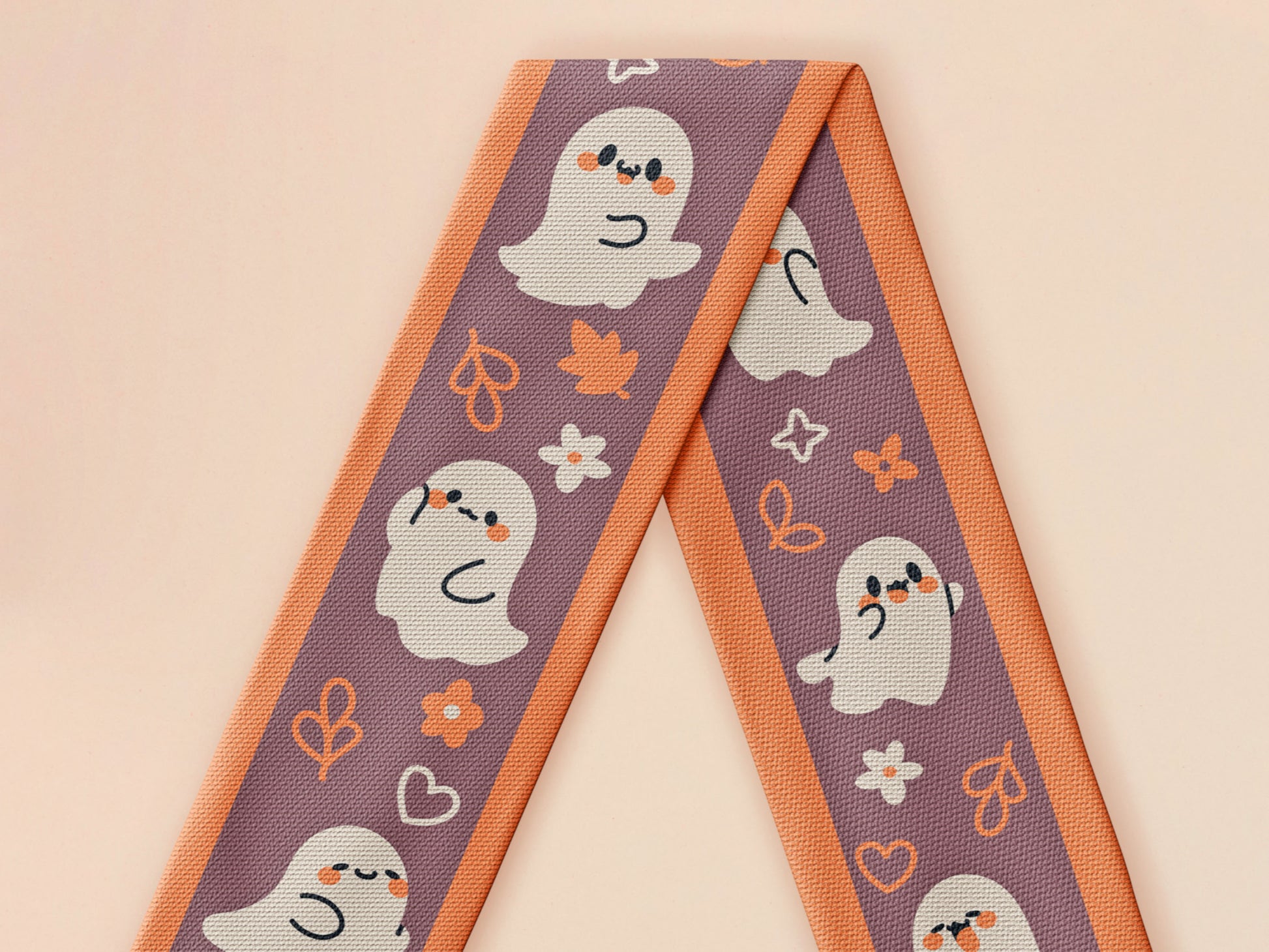 Cute knitted cotton scarf with fringe details and an autumn ghost themed pattern