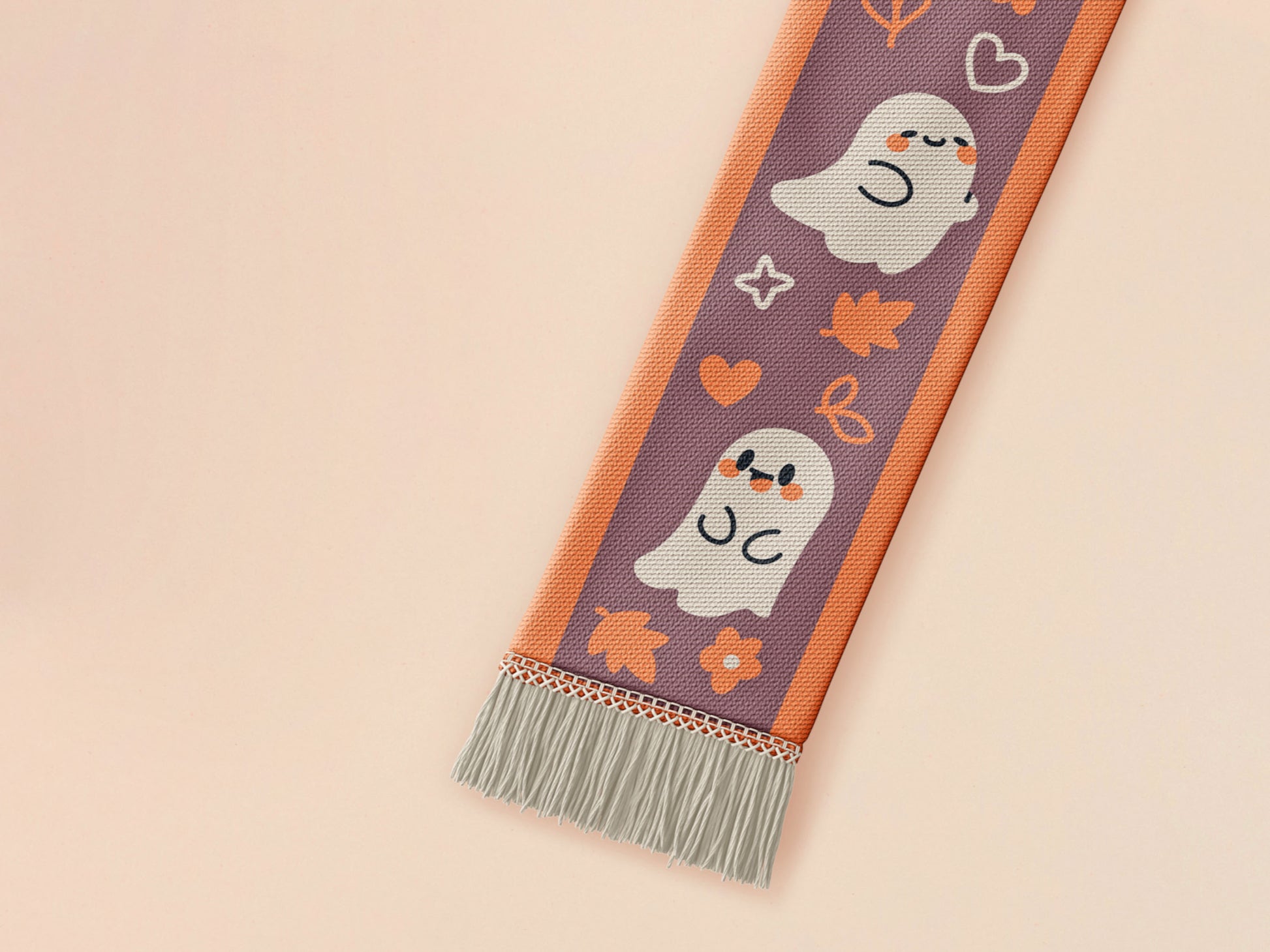 Cute knitted cotton scarf with fringe details and an autumn ghost themed pattern