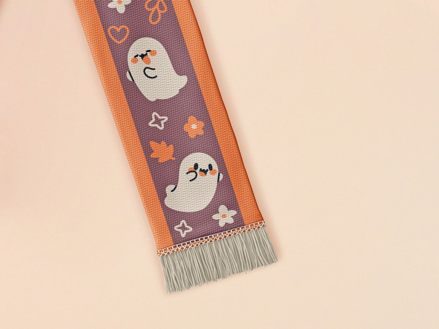 Cute knitted cotton scarf with fringe details and an autumn ghost themed pattern