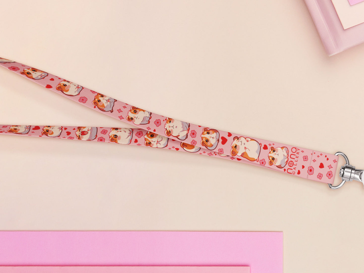 Cute full legth pink lanyard with a double sided guinea pig pattern and silver swivel hook clasp.