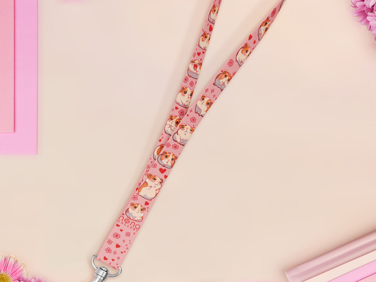 Cute full legth pink lanyard with a double sided guinea pig pattern and silver swivel hook clasp.