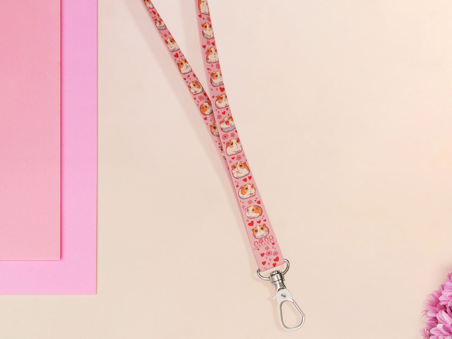 Cute full legth pink lanyard with a double sided guinea pig pattern and silver swivel hook clasp.